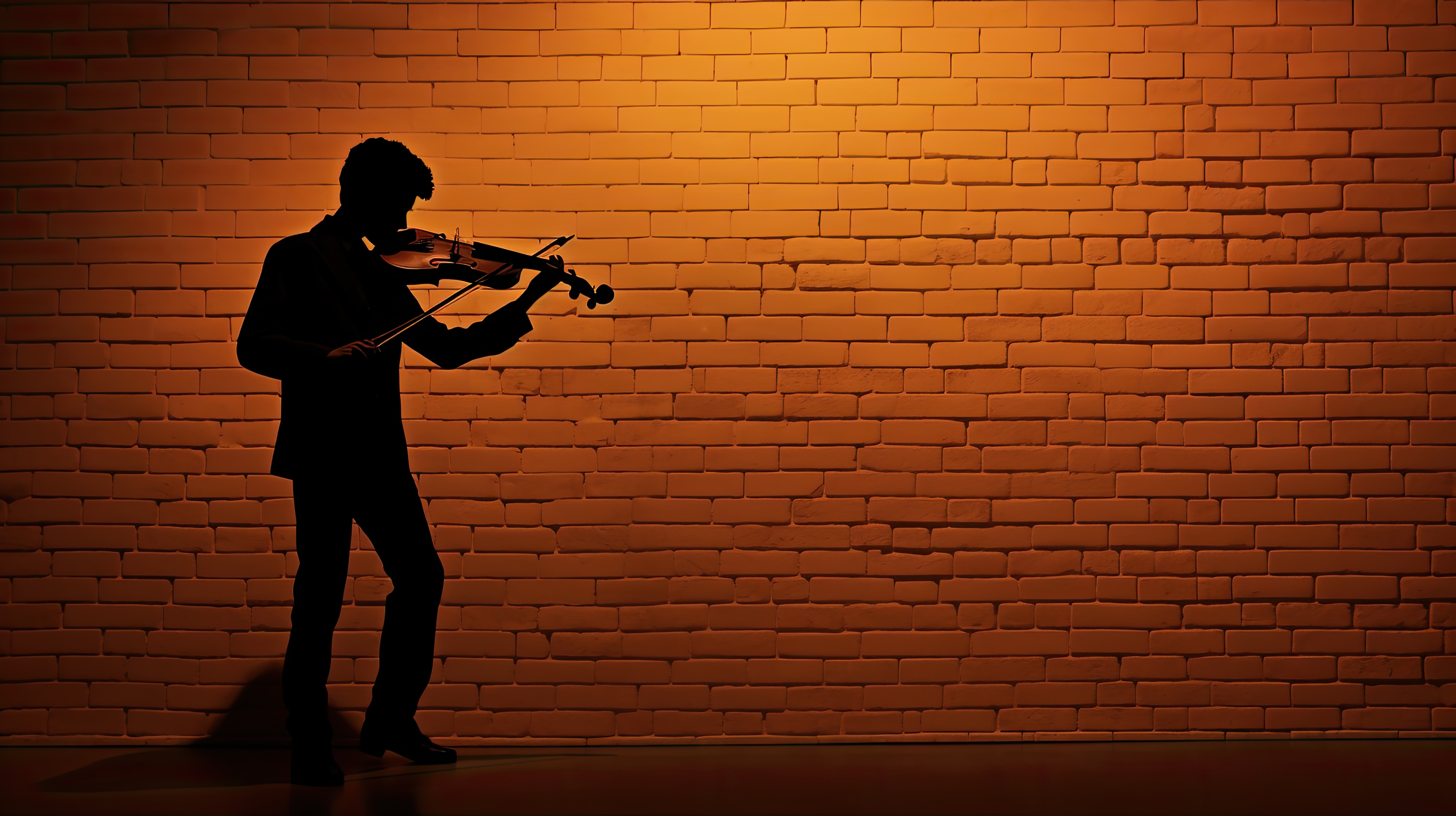 Brick wall backdrop for violinist s silhouette